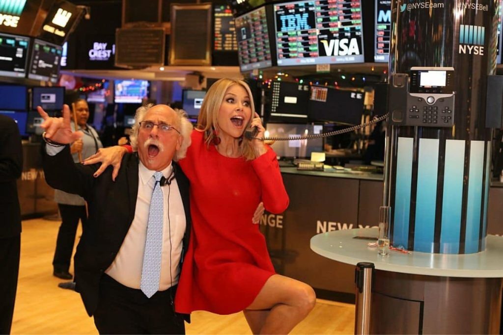 Model Christie Brinkley poses with her trader, Peter Tuchman, on the NY Stock exchange