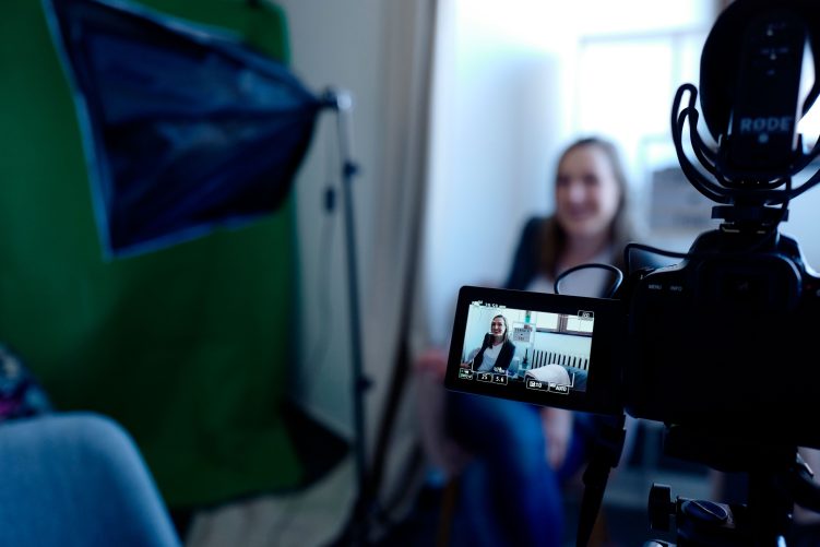 Performer records a camera audition in a studio, showing the modern self-tape casting process.