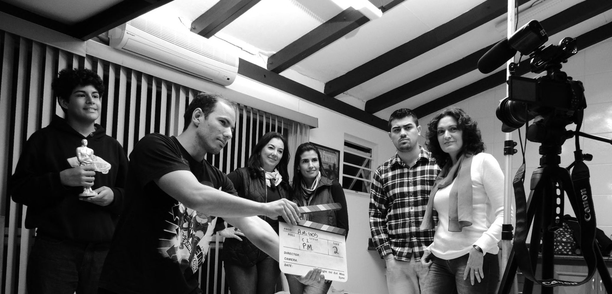 Film crew works with a clapperboard during production, illustrating the team-based casting environment.